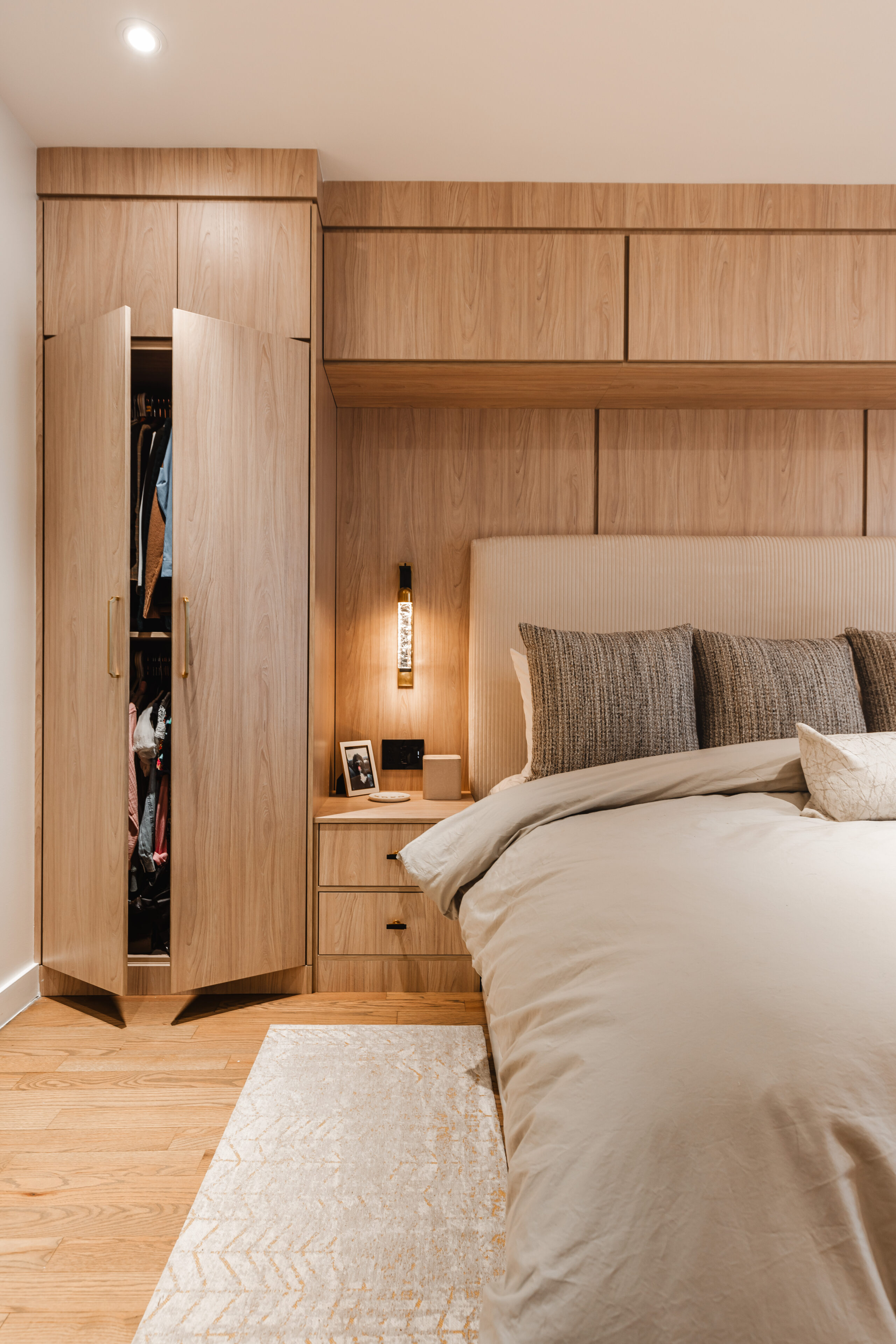 Discover a serene, cozy modern bedroom featuring minimalist design, neutral tones, and warm wood accents for a tranquil retreat.