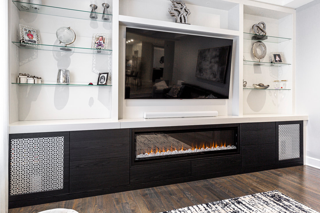 Sophisticated modern living room with a sleek entertainment unit, integrated fireplace, and stylish decor for a cozy ambiance.