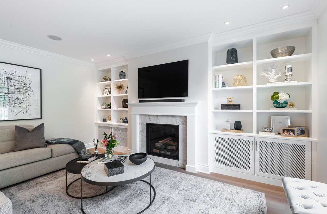 Discover a chic modern minimalist living room with a grey sectional, white fireplace, and stylish decor that invites comfort and elegance.