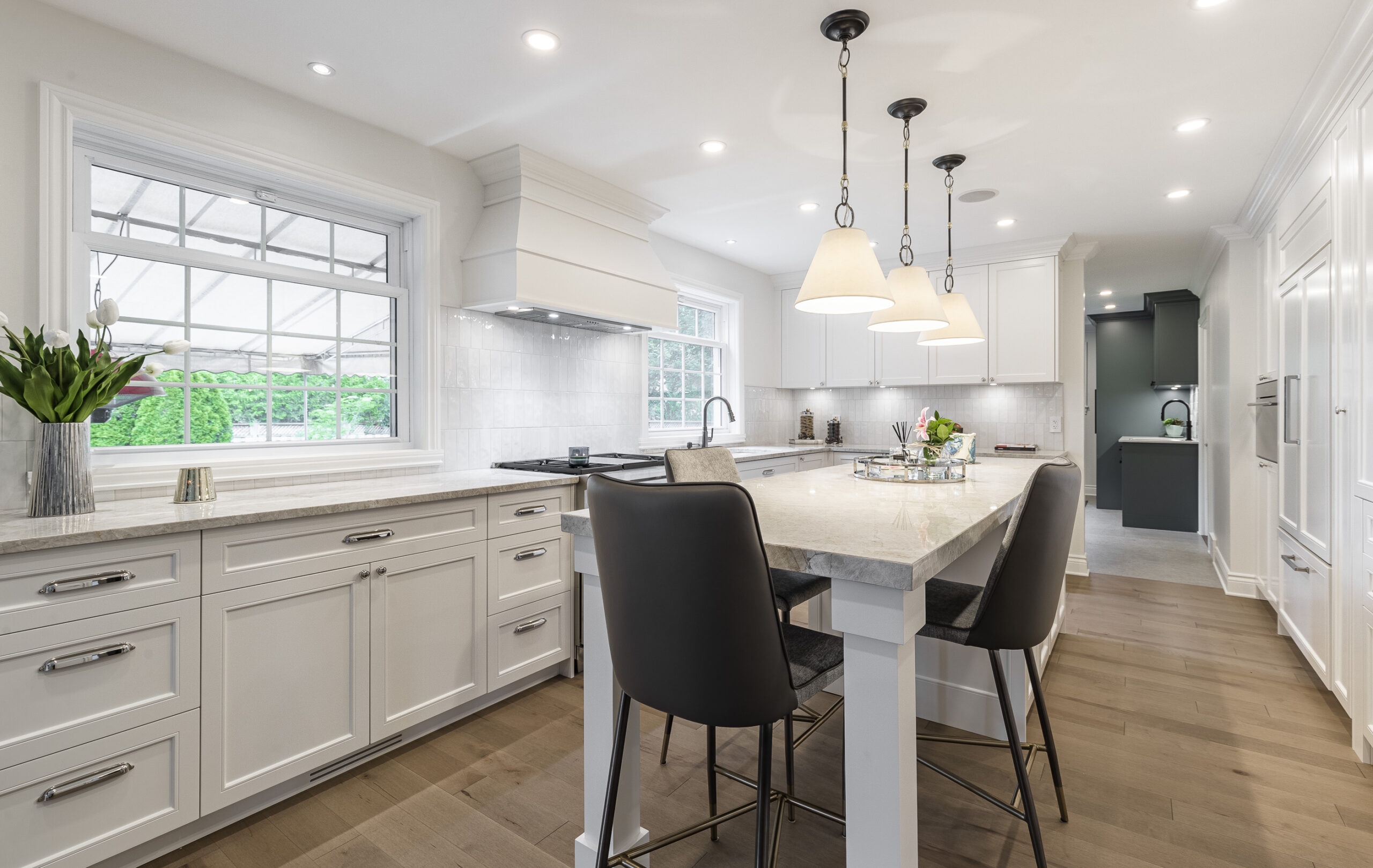 Experience the allure of this elegant modern kitchen, featuring a bright design, versatile island, and abundant natural light.