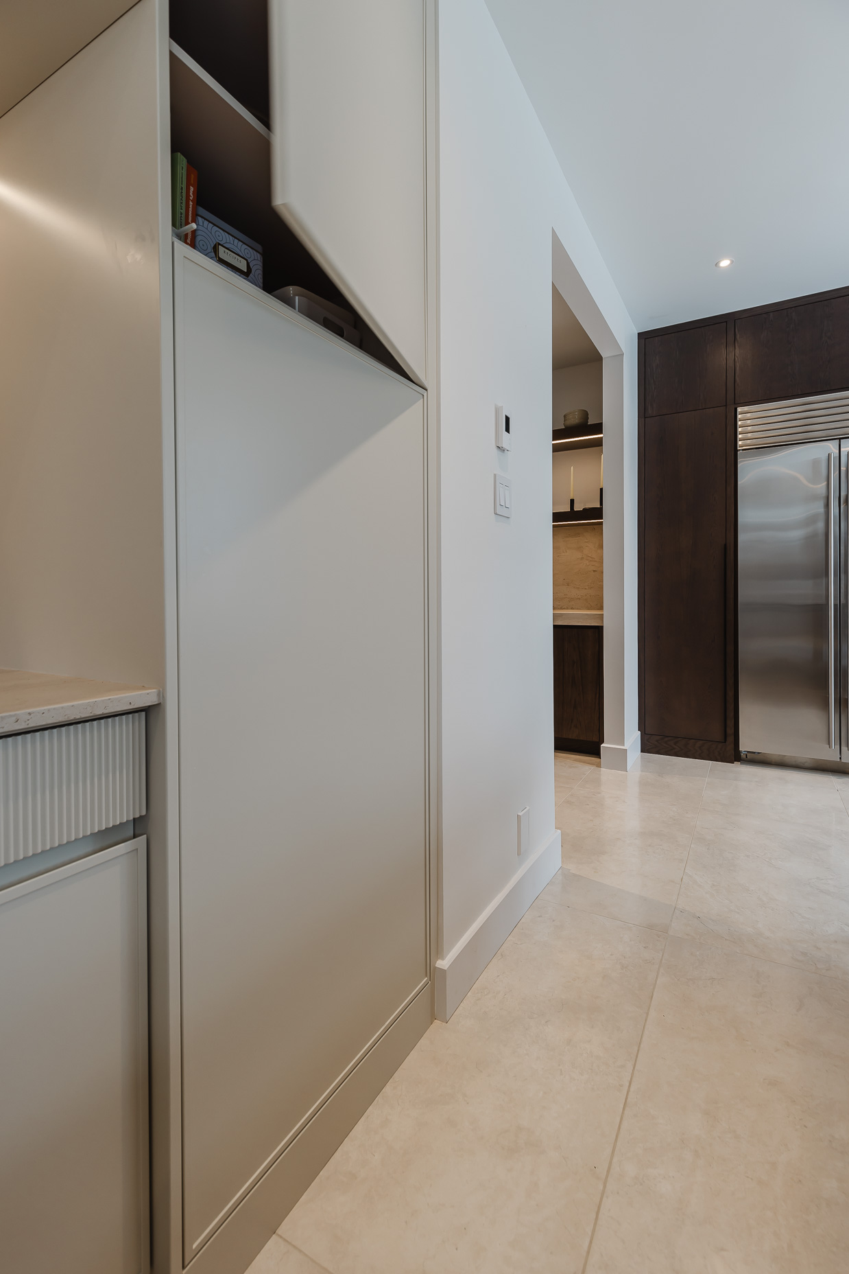 Stylishly modern kitchen featuring minimalist cabinetry, stainless steel appliances, and elegant touches that create an inviting space.