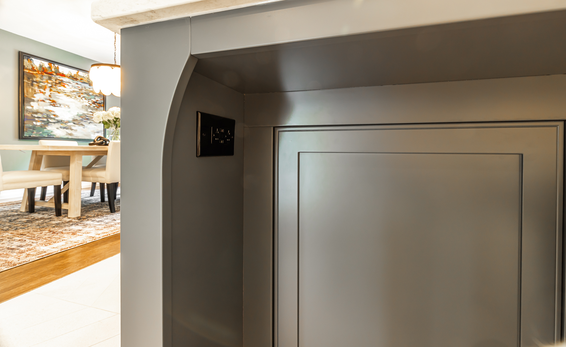 Modern kitchen island with sleek gray cabinetry and minimalist design for stylish functionality.
