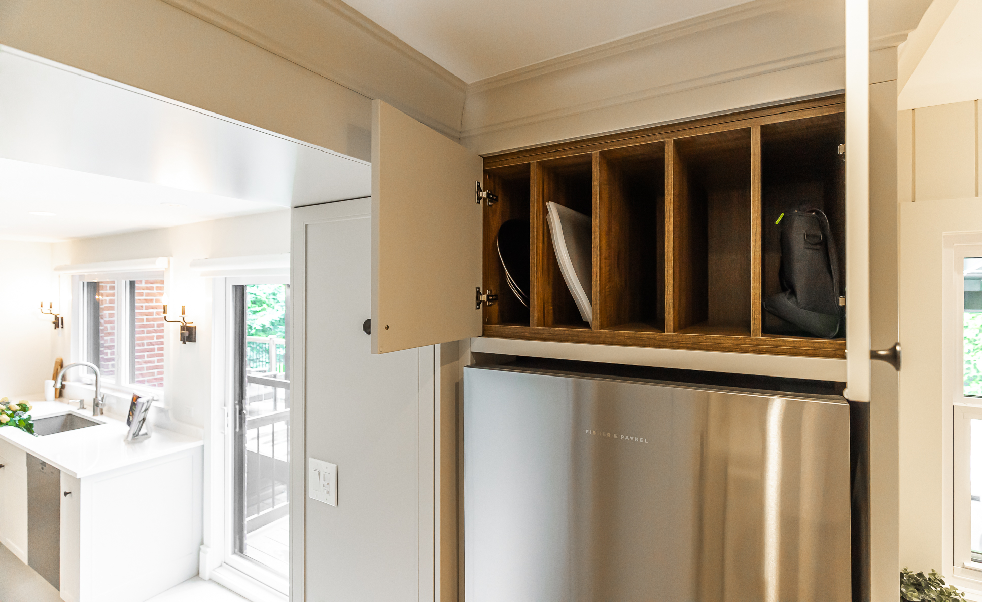 Modern kitchen with stainless steel appliances, organized storage, and bright, inviting ambiance.