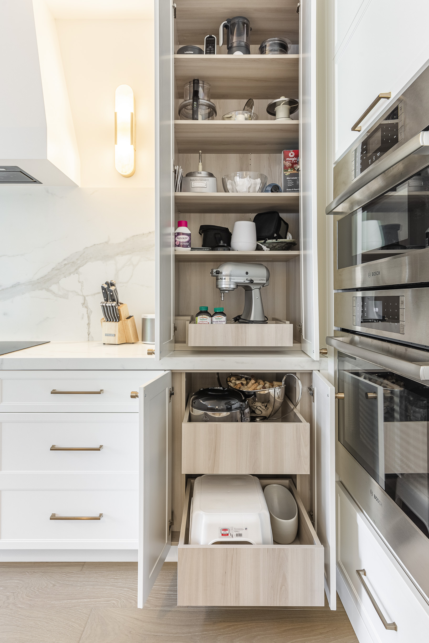 Discover a stylish modern kitchen storage unit with open shelves and organized drawers, perfect for efficiency and aesthetic appeal.