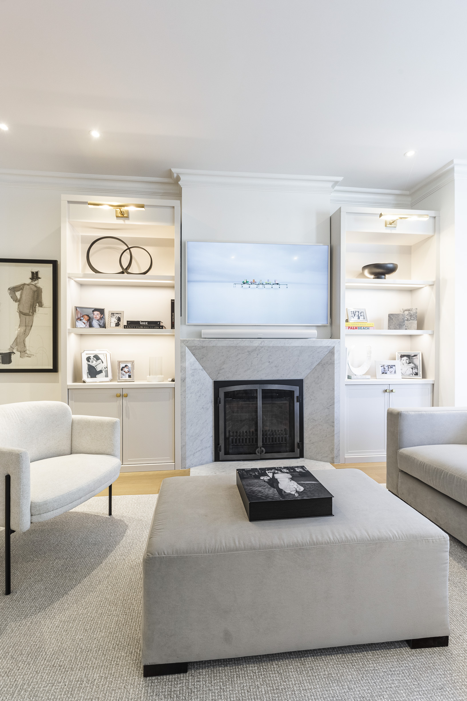 Discover a chic modern living room featuring a sleek fireplace, stylish furnishings, and a warm, inviting ambiance.