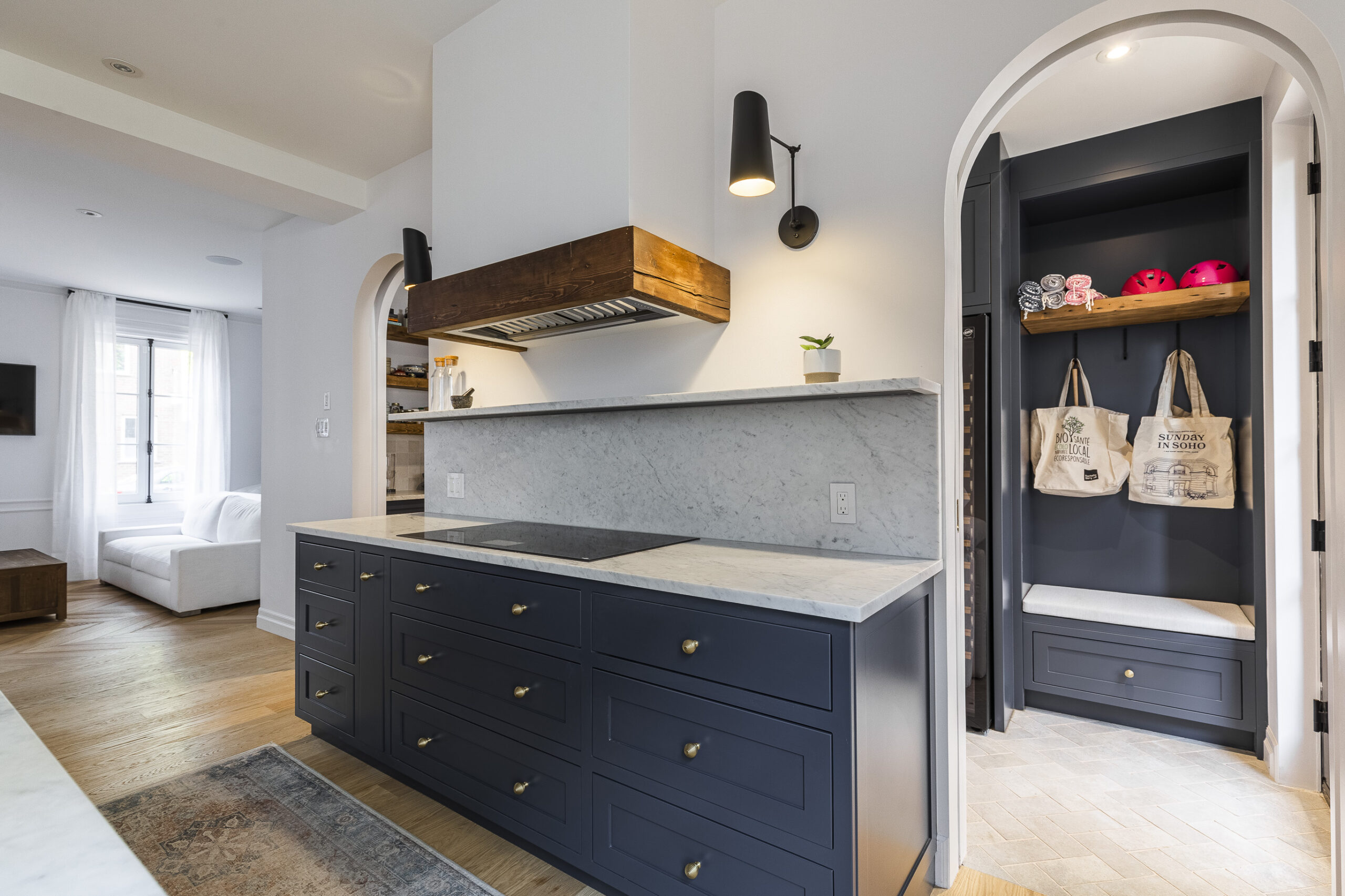 Discover a beautifully designed navy blue kitchen featuring a striking island, rustic accents, and inviting natural light.