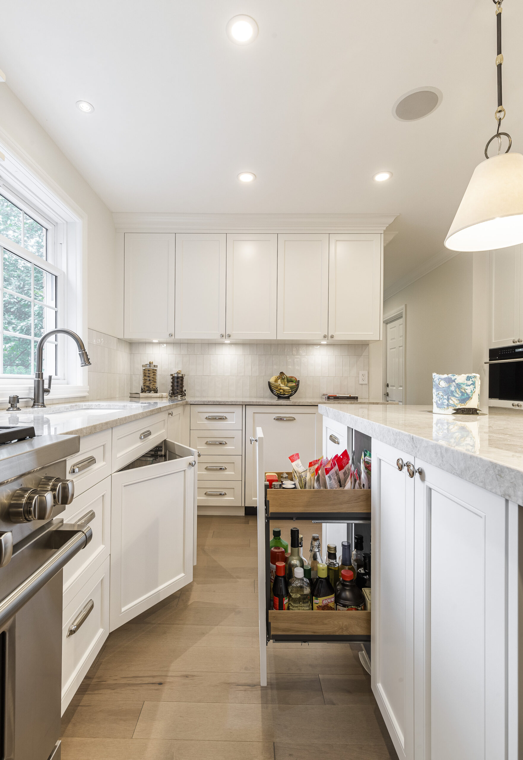 Discover a stylish modern kitchen featuring white cabinetry, spacious countertops, and smart storage solutions for effortless entertaining.